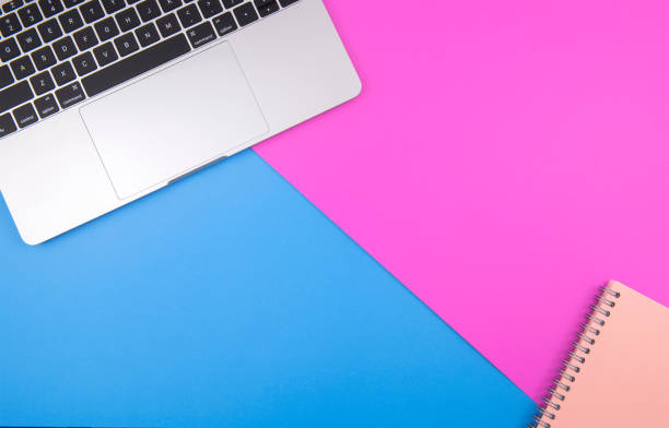 istock Laptops and notebooks Placed on the background against a pink background. Pastel bright colors 1176672957