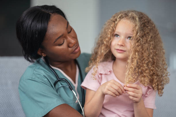 istock Kind nurse comforts child patient 1176673788