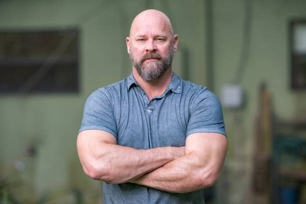 istock Macho man with arms crossed 1176676237