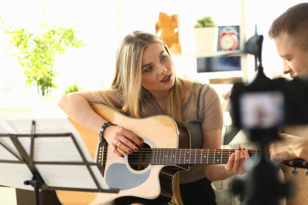 istock Young Couple Recording Music Studing Video Blog 1176676657