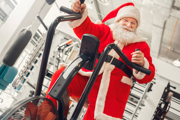 Santa Claus in the gym holiday concept stock photo