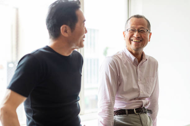 istock Senior man talking with friends smiling 1176681676