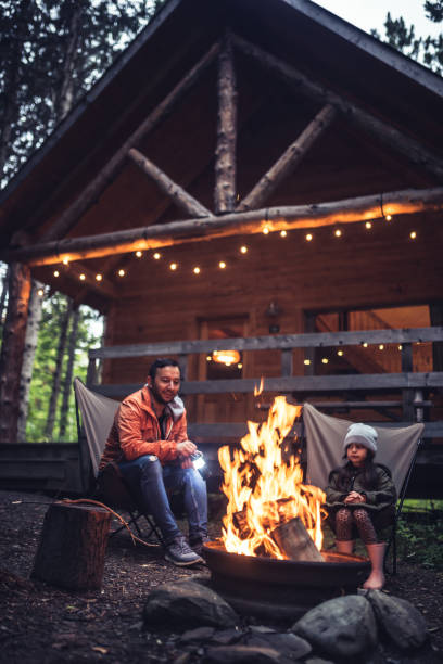 istock Father and daughter  chatting by the campfire 1176685041