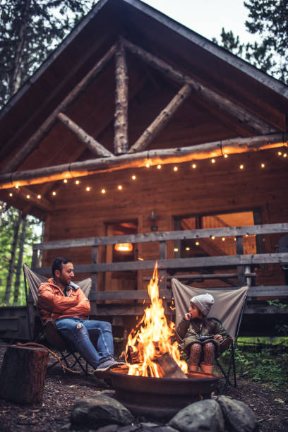 istock Father and daughter  chatting by the campfire 1176685088