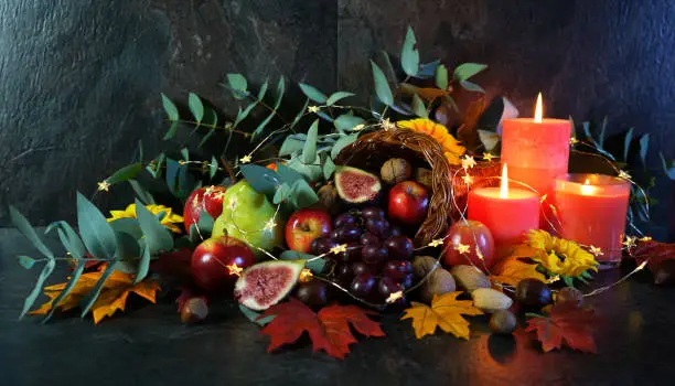 Photo of Thanksgiving cornucopia table setting centerpiece close up.