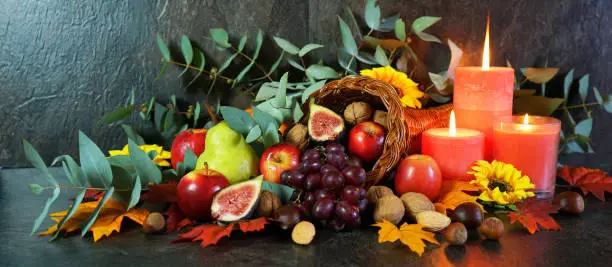 Photo of Thanksgiving cornucopia table setting centerpiece close up.