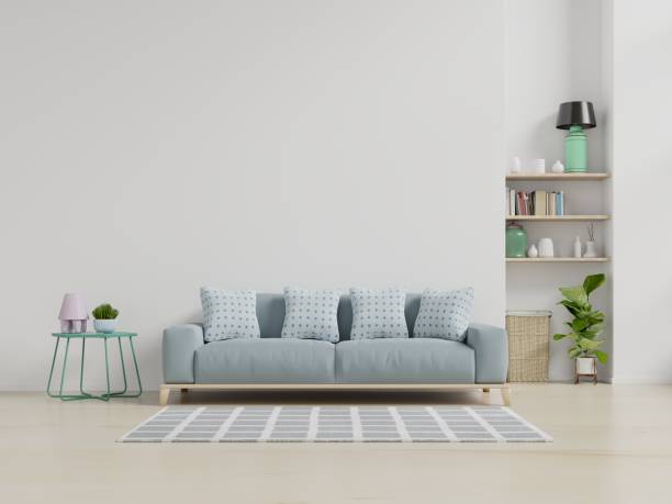 istock Modern living room interior with sofa and green plants,lamp,table on white wall background. 1176689205