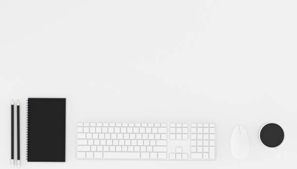 istock Top view of workplace with accessories,business text space on white table,Notebook,keyboard,cup of black coffee,pencils and computer.3D rendering. 1176689232