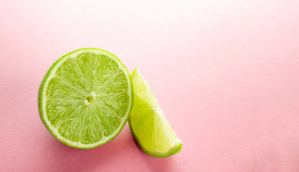 istock Lime slice. Green background. Fresh juicy green lime isolated on 1176689297