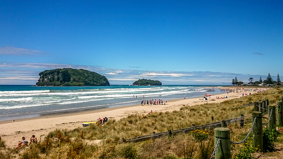 Whangamata, New Zealand -January 19, 2016: People enjoying a sunny day in Whangamata beach, New Zealand.