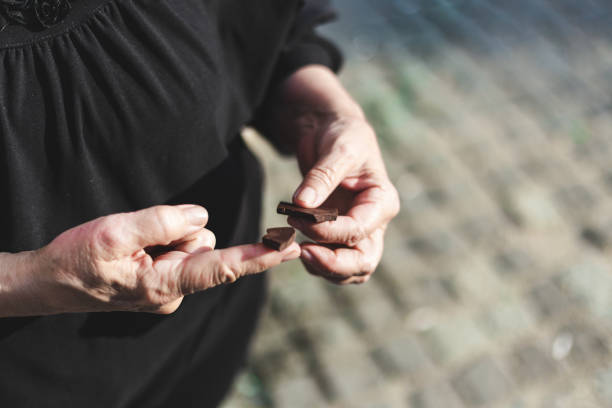 istock Old woman is about to eat chocolate 1176693721