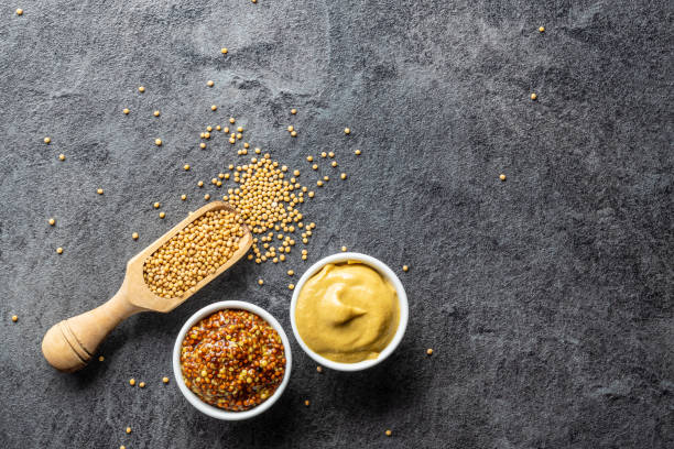 istock Yellow mustard and whole grain mustard. 1176696476