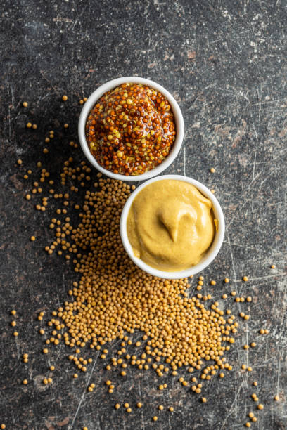 istock Yellow mustard and whole grain mustard. 1176696555
