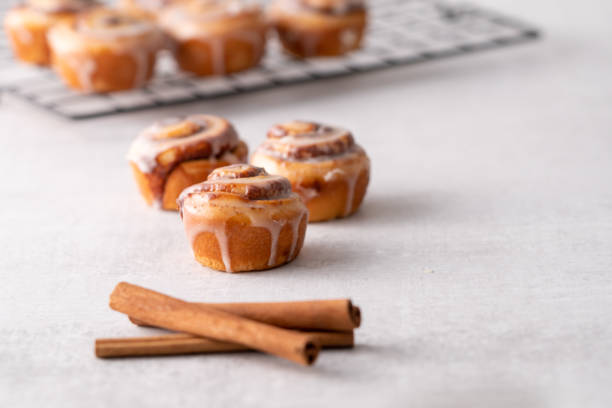 istock Homemade baked cinnamon rolls on cooling on cooling rack 1176696559