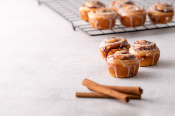 istock Homemade baked cinnamon rolls on cooling on cooling rack 1176696568