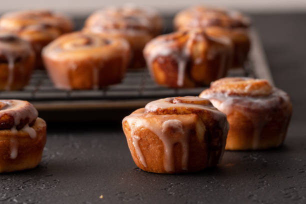 istock Homemade baked cinnamon rolls baked in a cookie sheet with icing. 1176696758