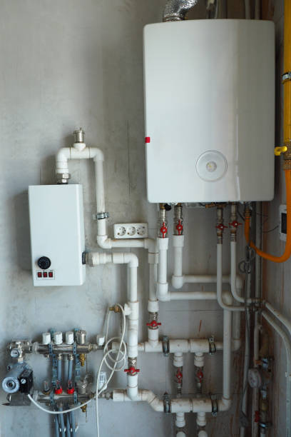 istock mounted communications in a built house. Gas boiler, heated floor, counters, sockets, water pump, heating, plastic pipes. 1176697669