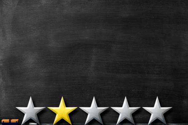 istock Row of five stars in front of blackboard 1176697670