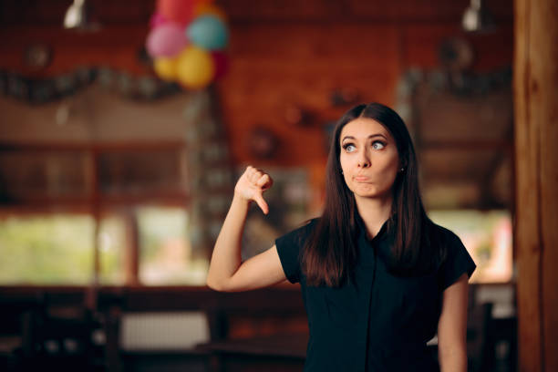 Upset Customer Showing Thumbs Down In a Restaurant