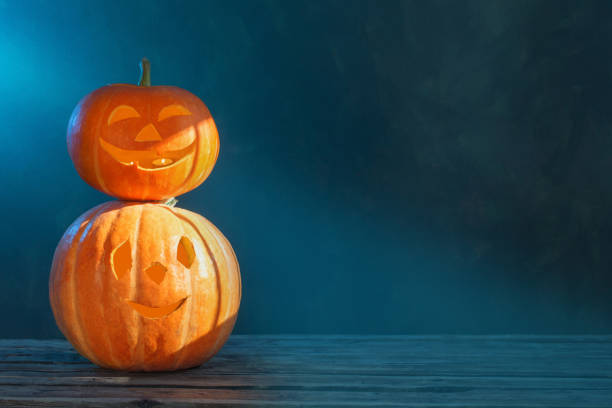 istock Halloween pumpkin on dark background 1176703275