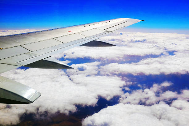 istock Passenger airplane flying over dramatic expanse of cloud 1176704273