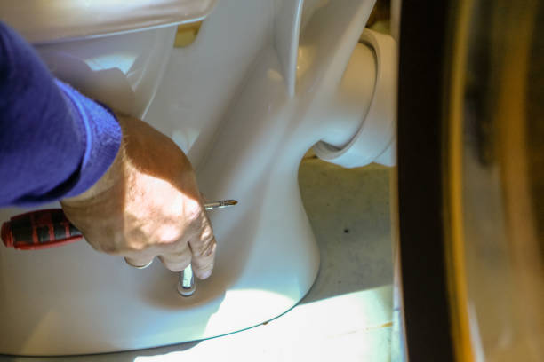 istock A plumber worker is installing a new toilet 1176705513