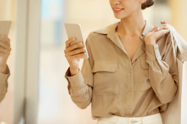 istock Shopaholic with mobile phone 1176708799