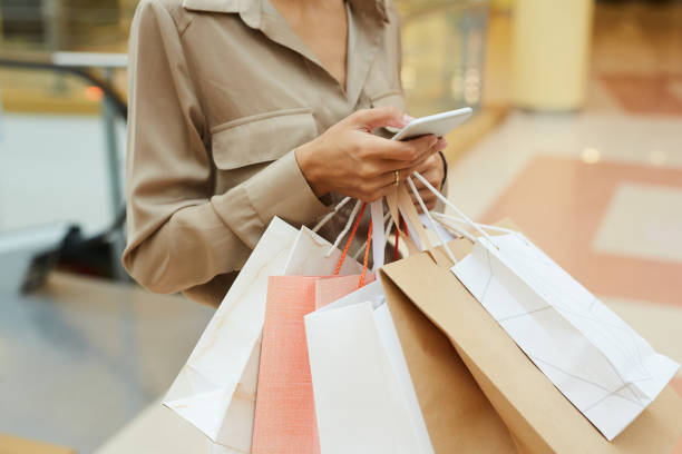 istock Woman holding purchases 1176710174