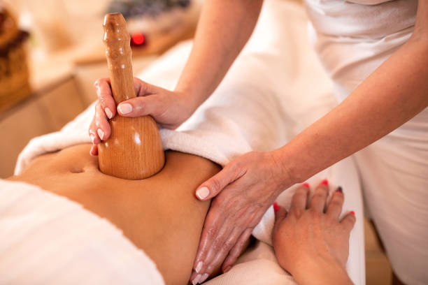 istock Masseuse massaging the abdominal area 1176711086