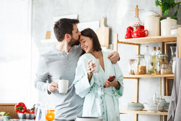 istock Young couple cuddling in the morning 1176711458