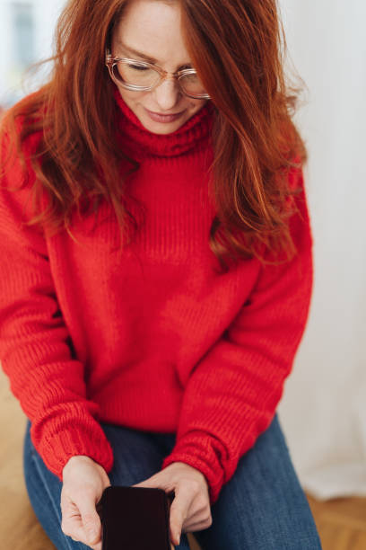 istock Woman concentrating on an object in her hands 1176713711