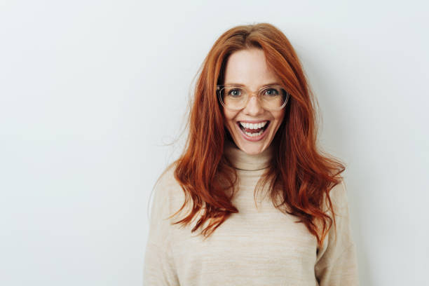 istock Excited redhead woman wearing glasses 1176713779