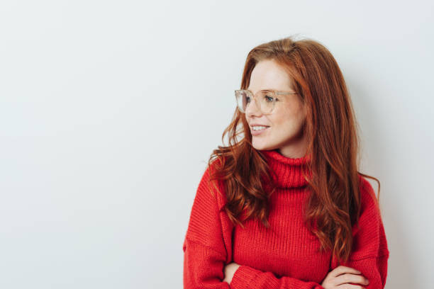istock Thoughtful redhead woman with folded arms 1176715009