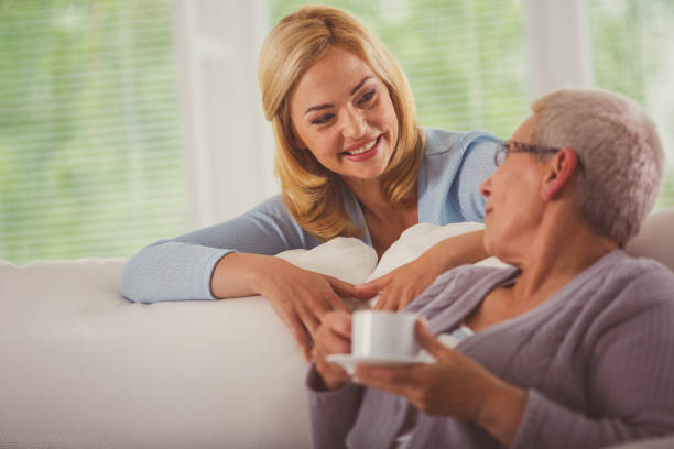 istock Mother and daughter having a conversation over cup of coffee 1176715018
