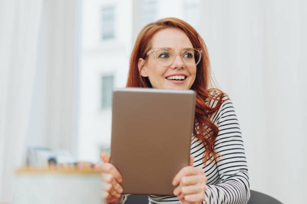 istock Young woman looking aside in amusement 1176715761