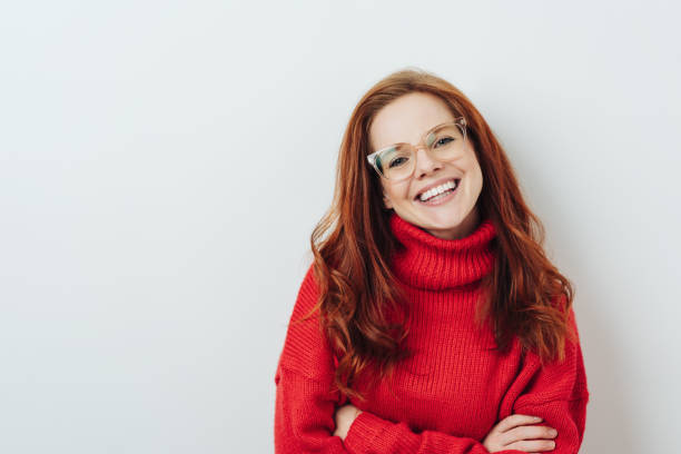 istock Happy young redhead woman with folded arms 1176715922