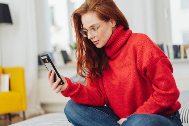 istock Young woman reading her mobile in consternation 1176716281