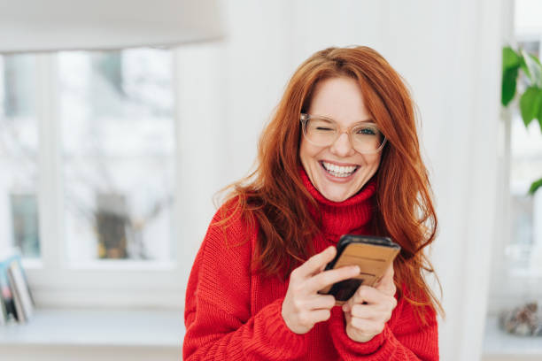 istock Cheeky young woman winking at the camera 1176716424
