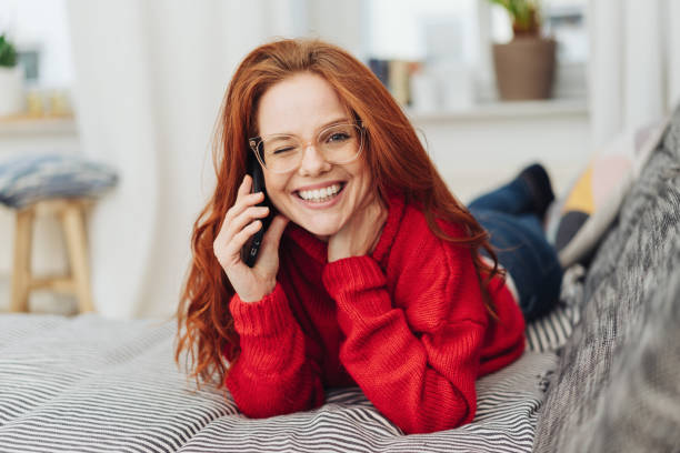 istock Playful young woman winking at the viewer 1176717092