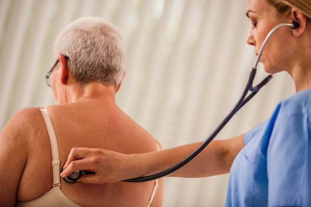 istock Nurse using stethoscope to check senior woman's heart beat 1176717247