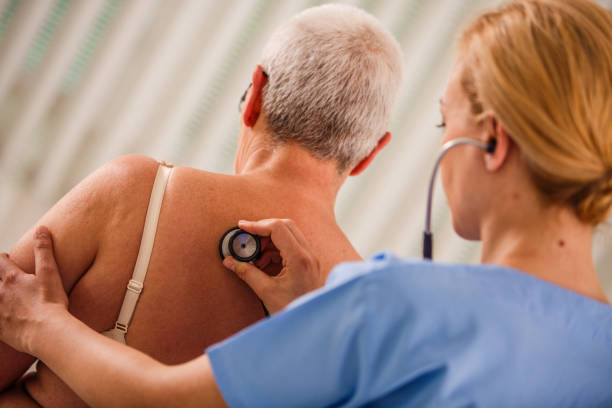 istock Unrecognizable senior woman getting examined by a nurse 1176717254