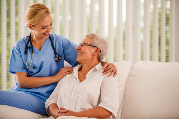 istock Smiling nurse and senior woman having a relaxing conversation 1176718315