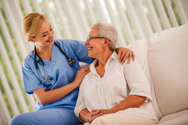 istock Smiling nurse having a relaxing conversation with her senior patient 1176718322