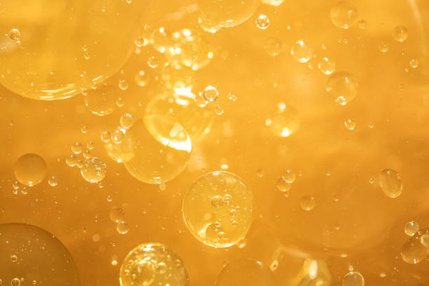 istock golden yellow bubble oil droplet, abstract background 1176718687