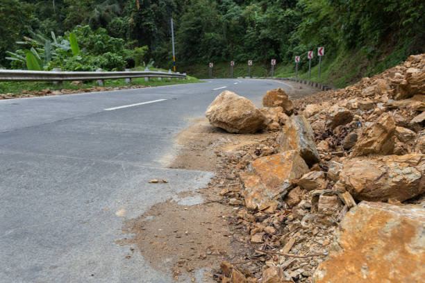 Photo of A dangerous rocky road in a mountainous landslide steep area