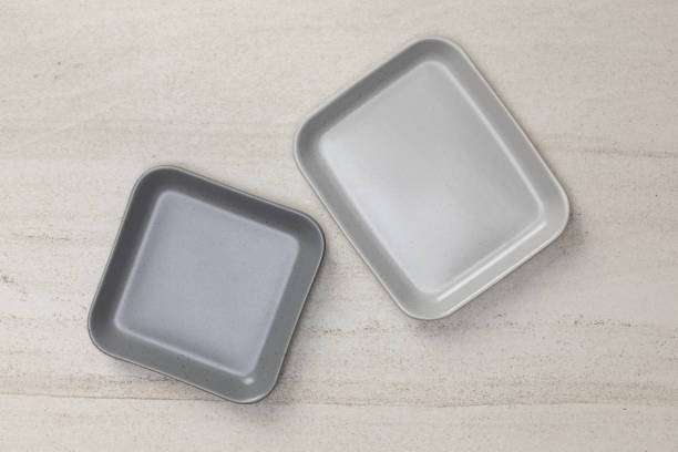 istock Group of empty blank ceramic square plates on white stone blackground, Top view of traditional handcrafted kitchenware concept 1176719493