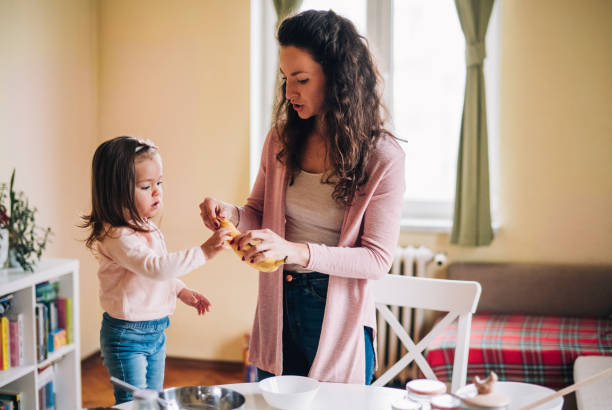 istock Happy mother and daughter in kitchen 1176720884