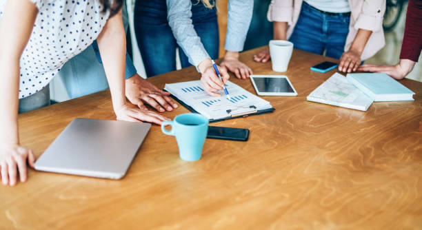 istock Close up of freelancers hands working by desk 1176721026