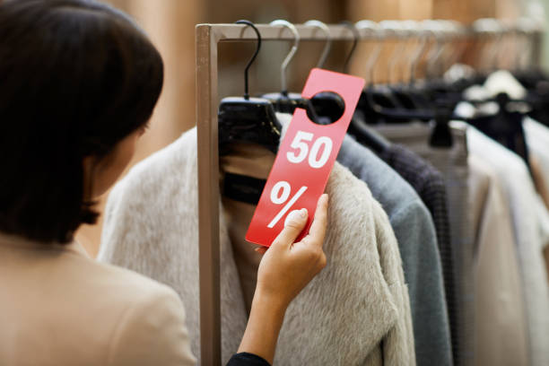 istock Customer Choosing Clothes on Sale 1176723701