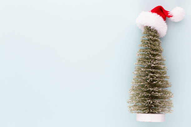 istock Christmas tree on pastel colored background. Christmas or New Year minimal concept. 1176725755